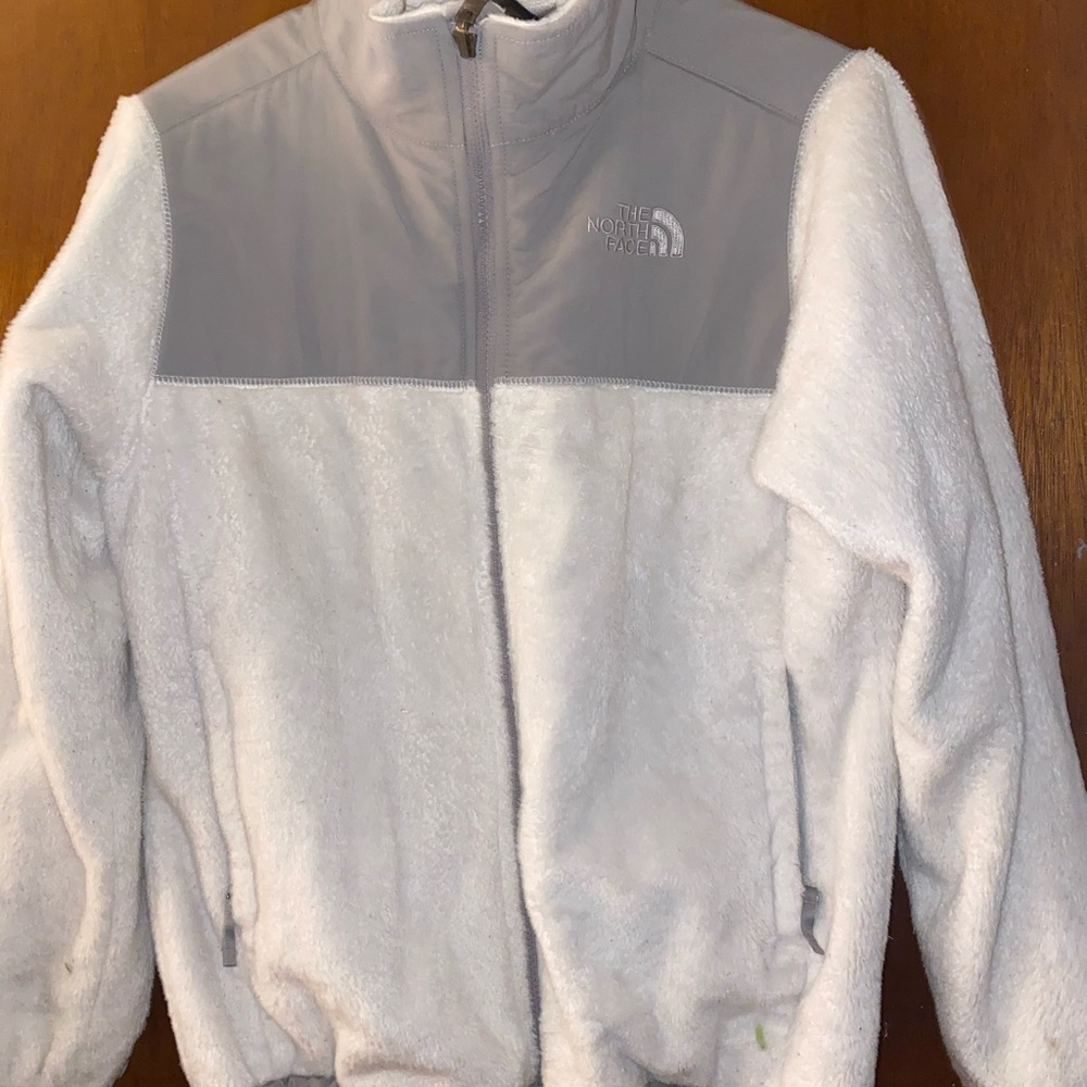 white and grey north face jacket